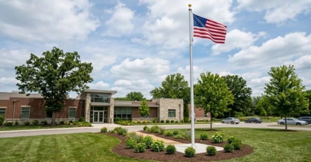 Two project photos showing a proposed flagpole installation area and existing property hardware